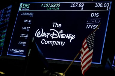 A screen shows the logo and a ticker symbol for The Walt Disney Company on the floor of the New York Stock Exchange (NYSE) in New York, U.S., December 14, 2017.