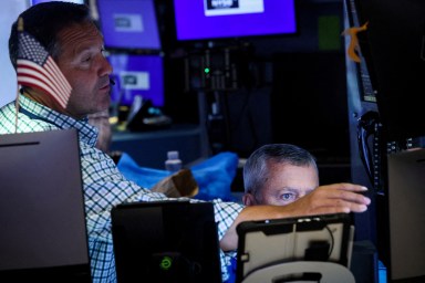 Traders work on the floor at the New York Stock Exchange (NYSE) in New York City, U.S., July 3, 2024.