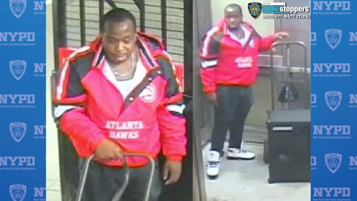 Man in red jacket in a subway station