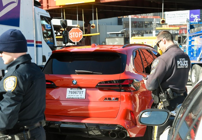 A BMW driver busted with an expired temporary plate near the Queens Midtown Tunnel 