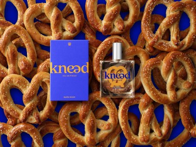 Auntie Anne's new perfume resting on top of a pile of pretzels