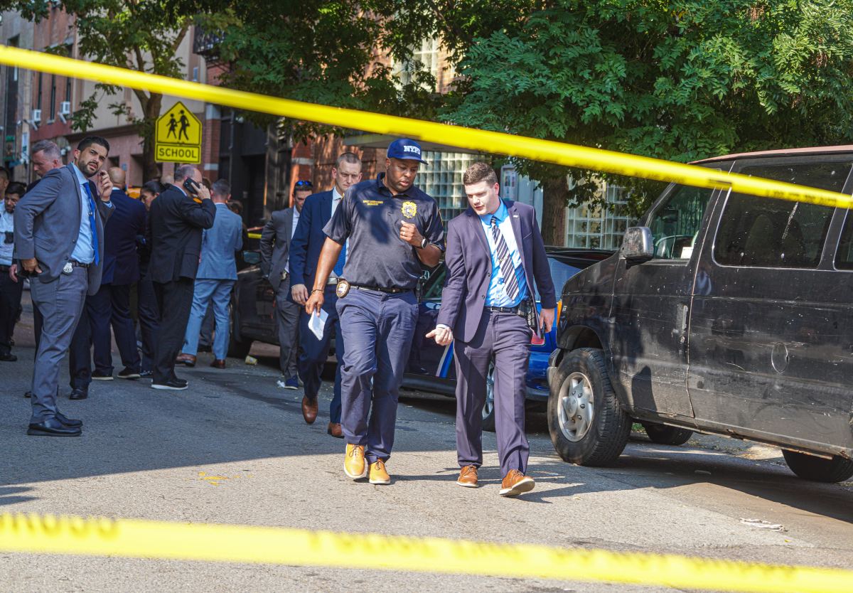 Police investigate scene in Lower Manhattan where two officers were shot