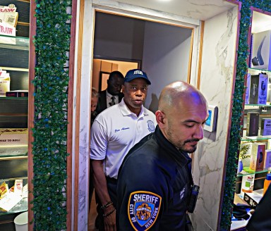 Mayor Adams and law enforcement officers during a Padlock to Protect operation.