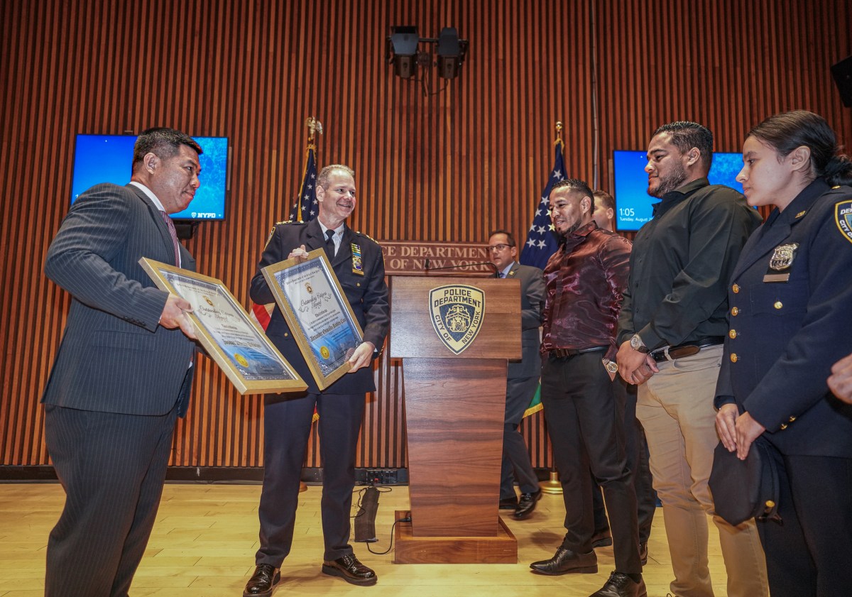 NYPD Chief of Transit Michael Kemper presents awards to the heroes