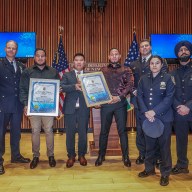 Migrants and police honored for saving woman in Queens