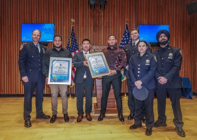 Migrants and police honored for saving woman in Queens