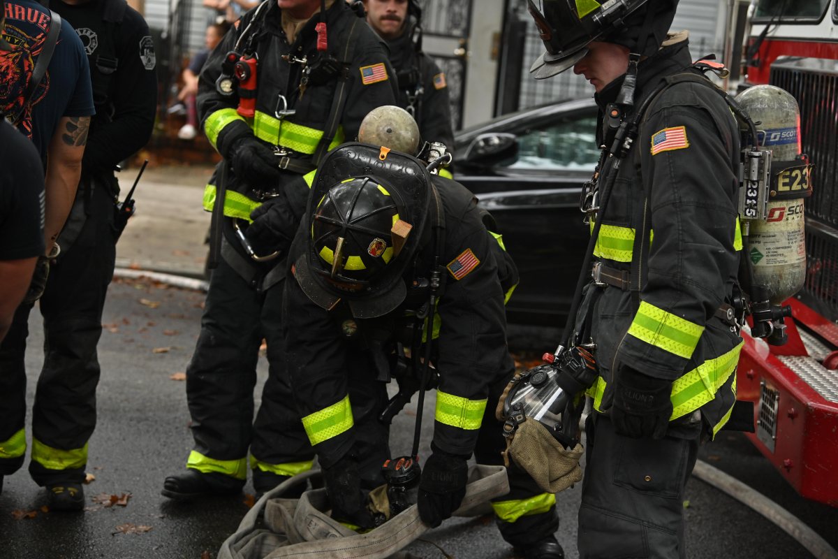 Firefighters operate in the rear during a three alarm fire at 80-16 80 Street.