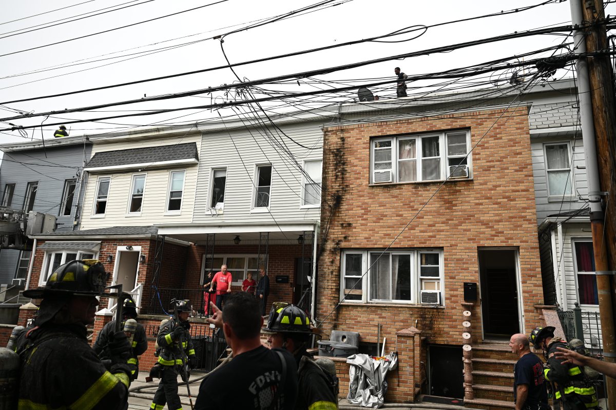 Firefighters operate in the rear during a three alarm fire at 80-16 80 Street.