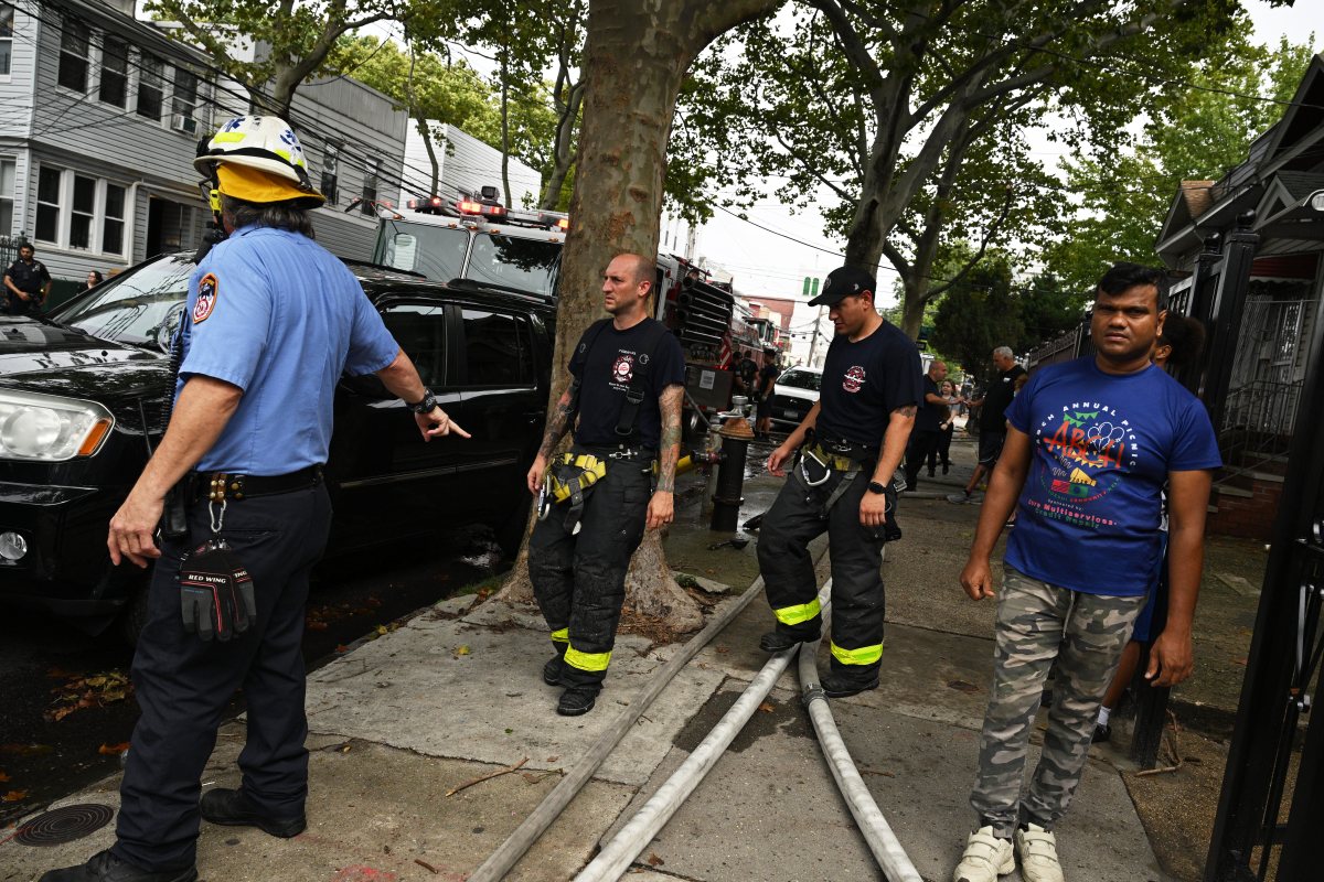 Firefighters operate in the rear during a three alarm fire at 80-16 80 Street.