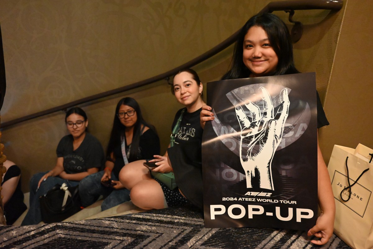 Girls displaying poster