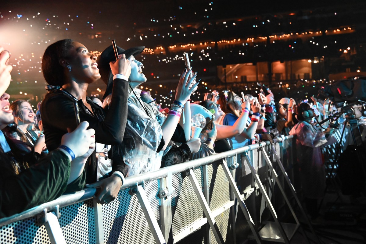 Fans in the crowd of the ATEEZ show.