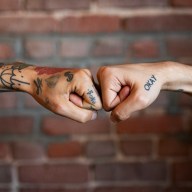 Friends giving each other a fist bump