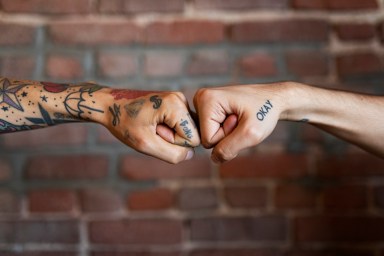 Friends giving each other a fist bump