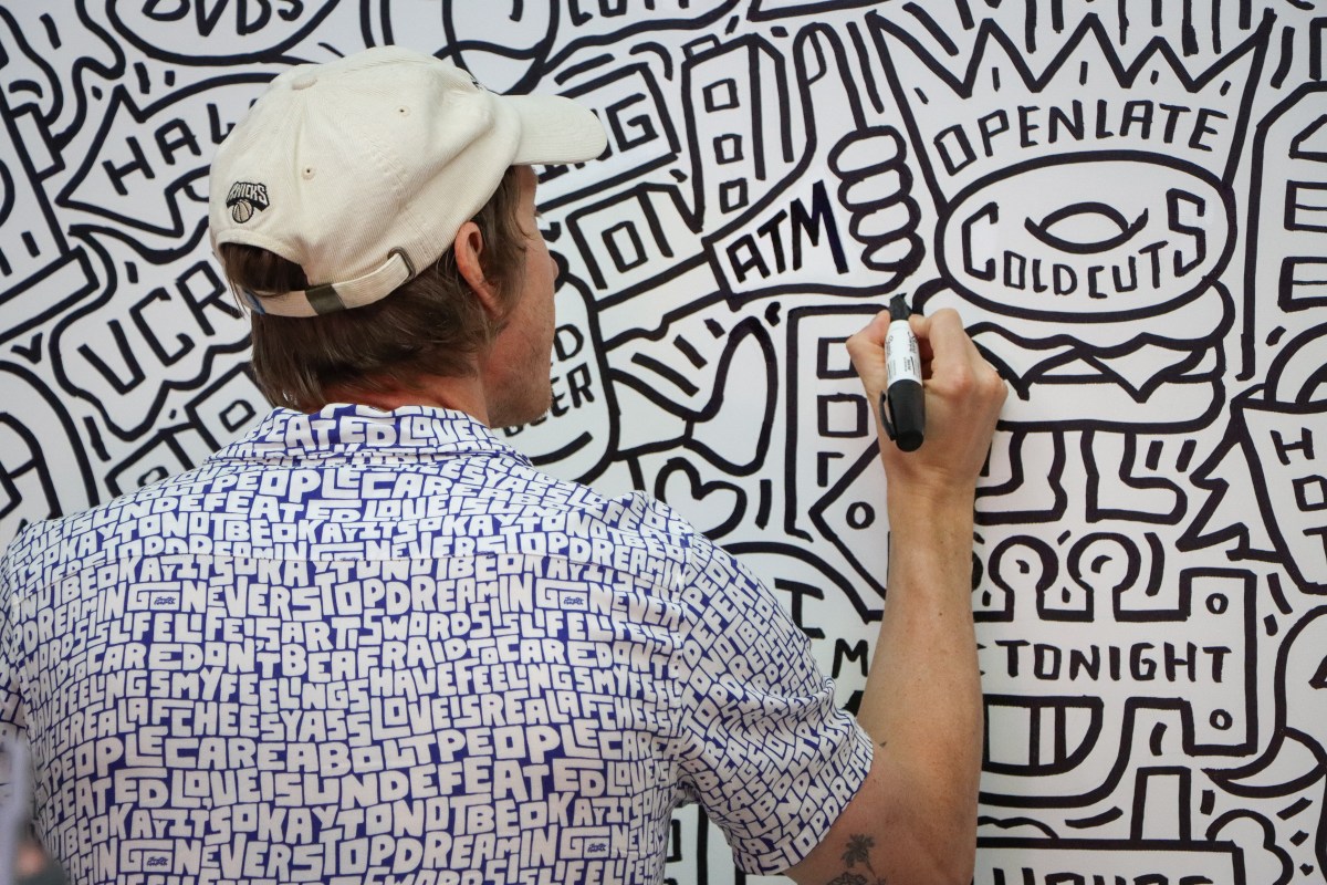 Timothy Goodman drawing on the wall