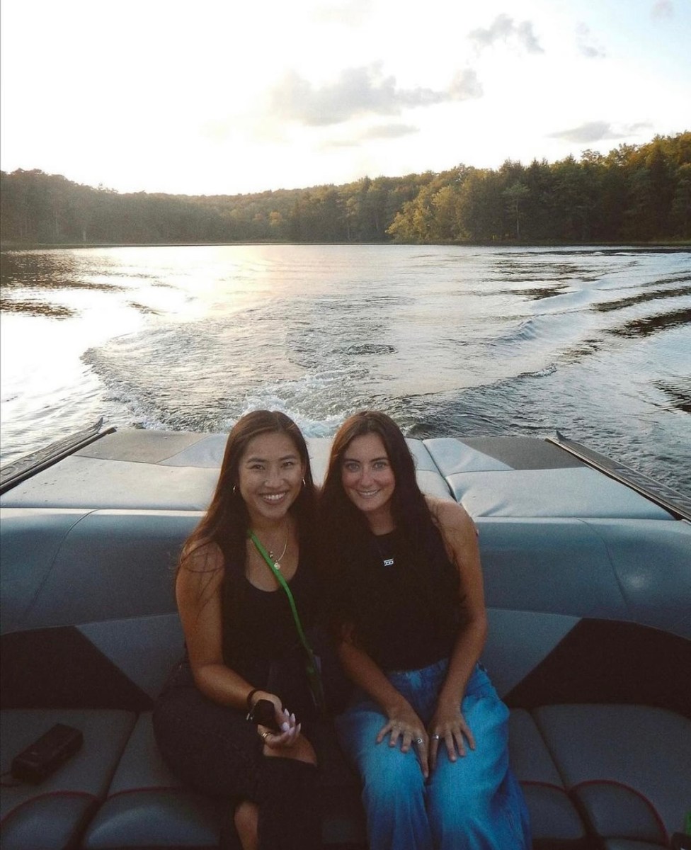 Two campers pose on a boat in The Poconos in Pennsylvania. 