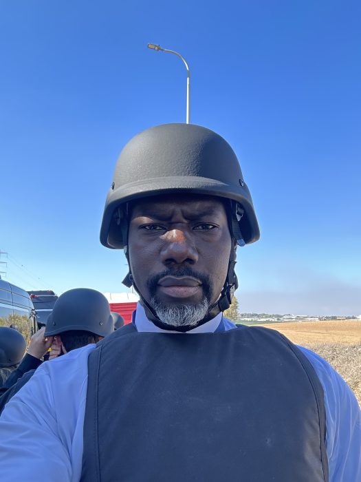 an wearing bullet proof vest and helmet