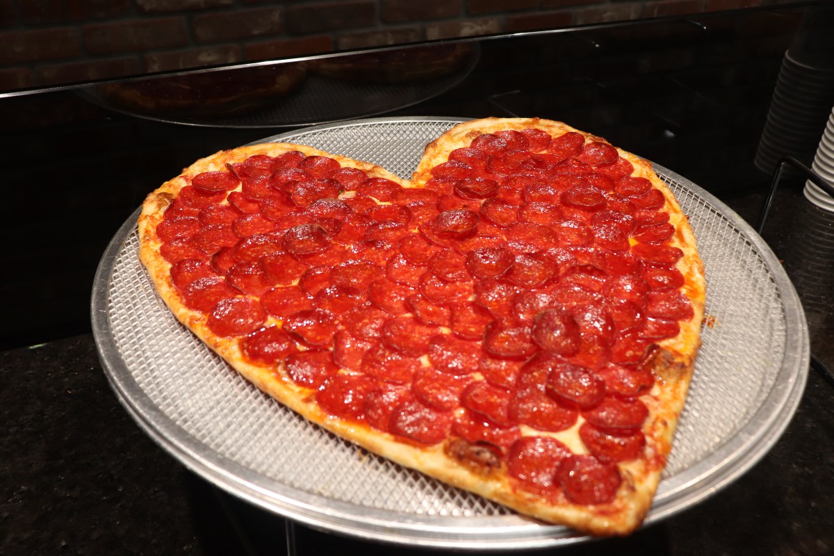 a heart shaped pepperoni pizza