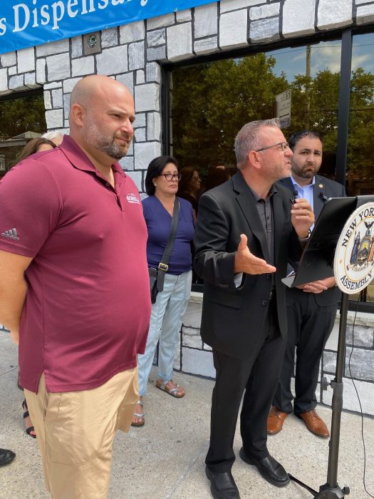 four people surround a podium on Staten Island