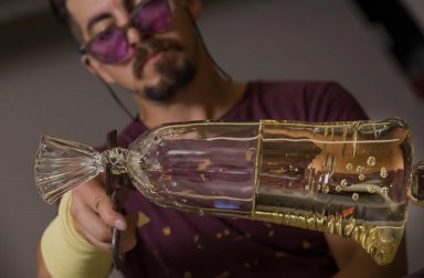 Sculpture artist Dylan Martinez working on glass