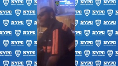 man dressed in black and orange wanted for an alleged assault in the Bronx