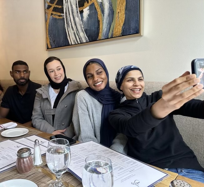 four people at a restaurant table