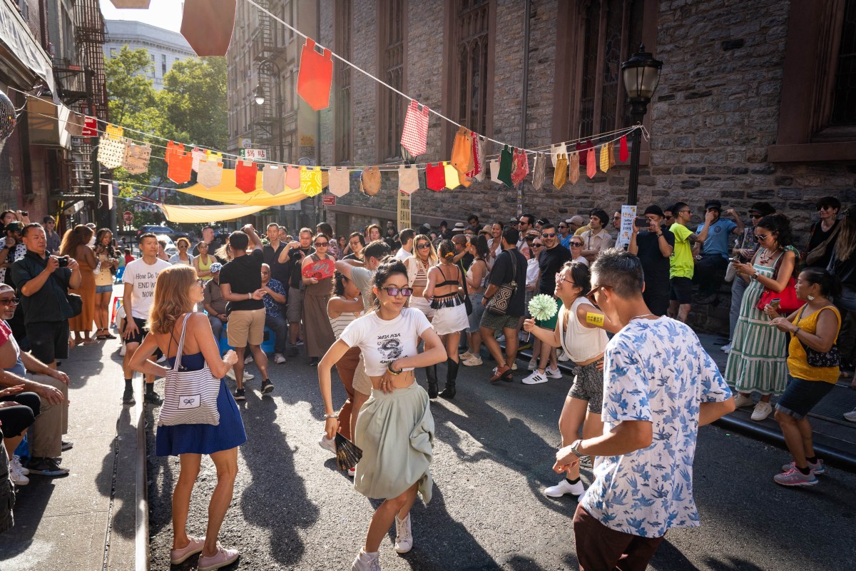 A community festival with Chinese pop music and salsa dancing in the heart of Chinatown