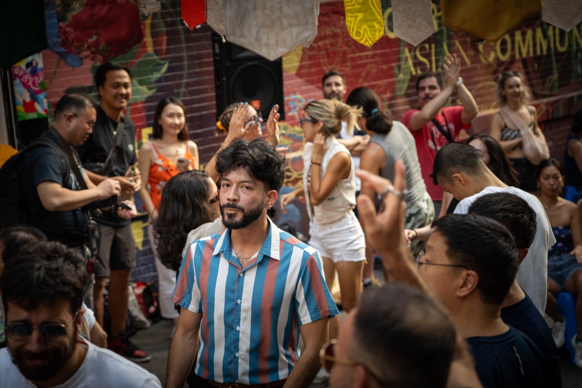 Guests celebrate a block party in Chinatown.