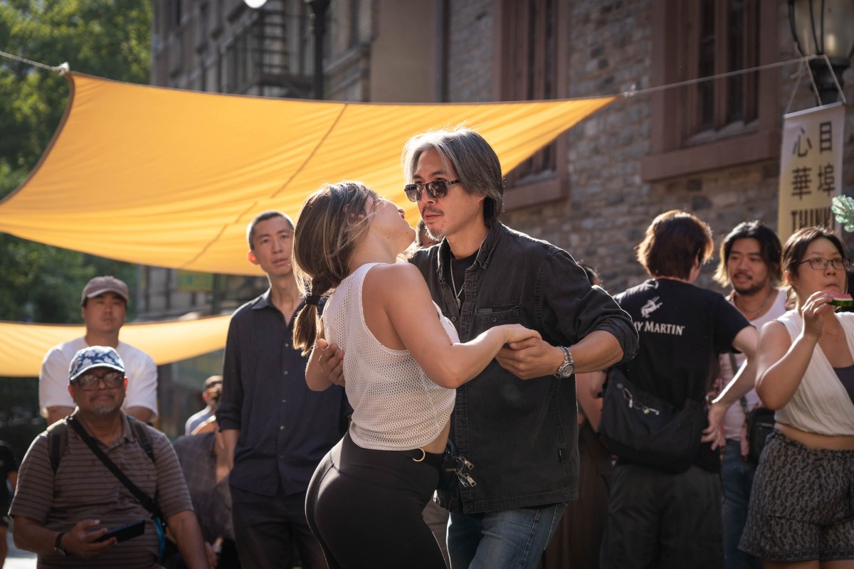 Guests salsa dancing at the block party.