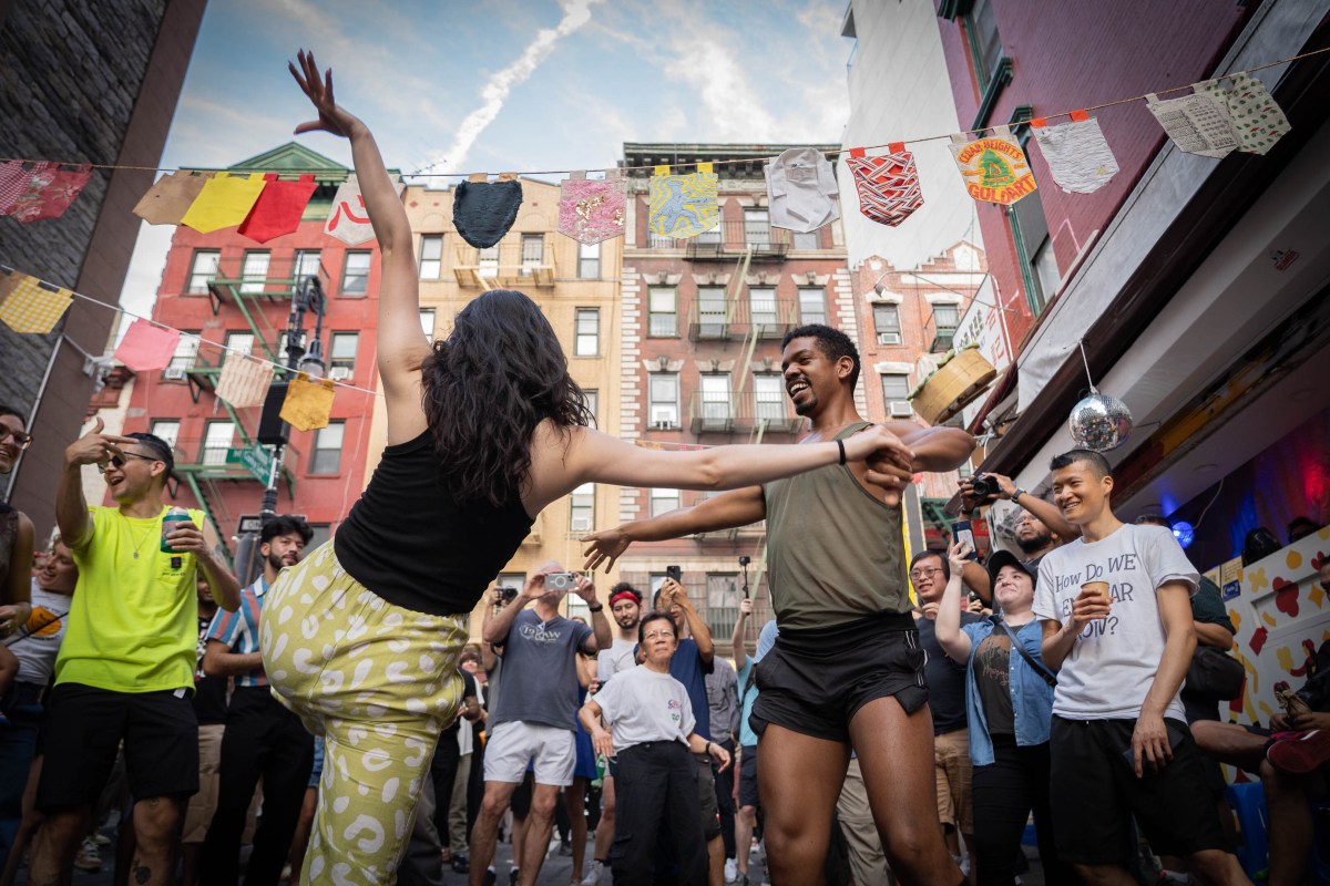 Guests celebrate a block party in Chinatown.