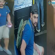 man wearing a blue shirt and tan pants wanted for allegedly assaulting a man in Brooklyn