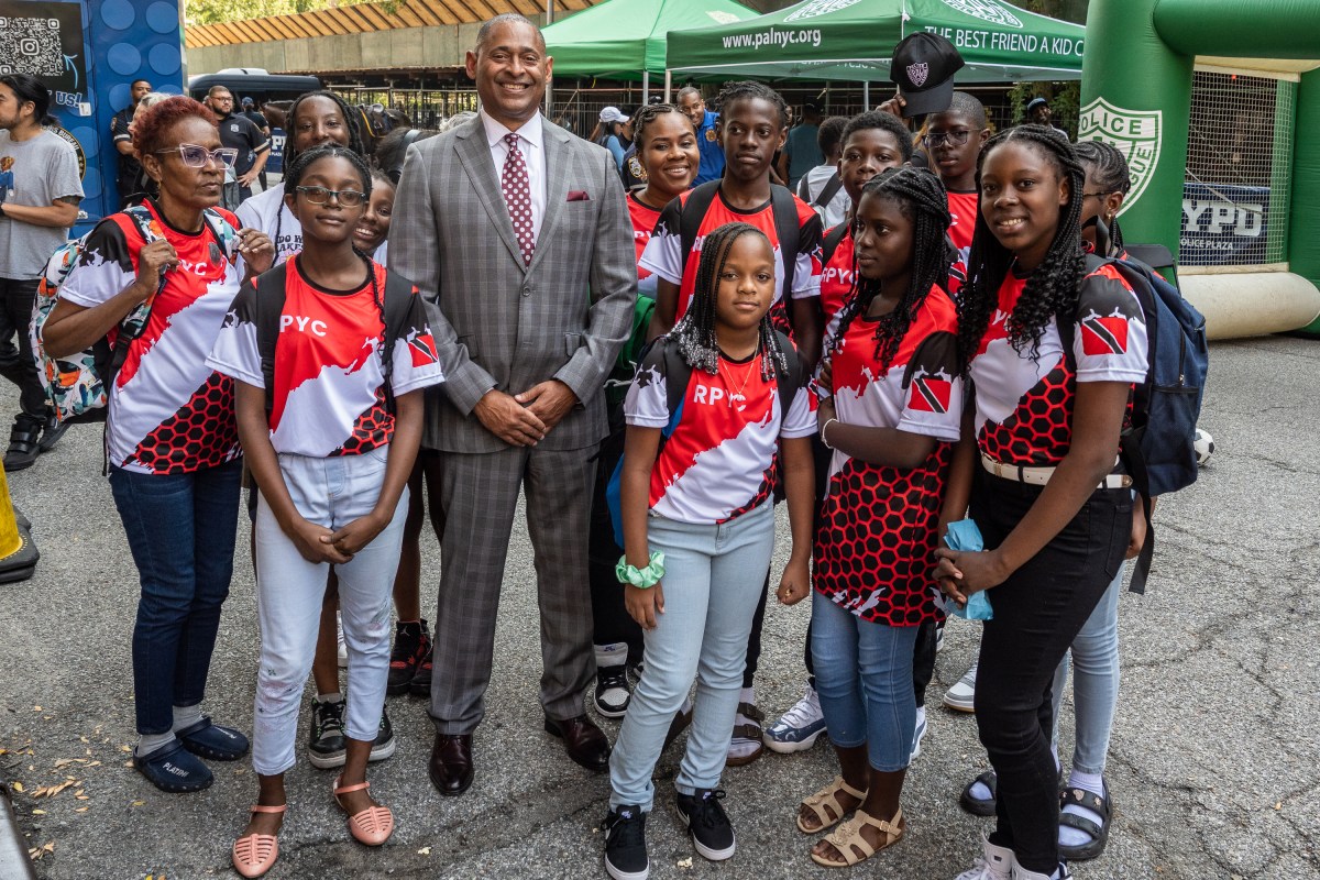 NYPD Deputy Commissioner Mark Stewart (middle) with a group of students