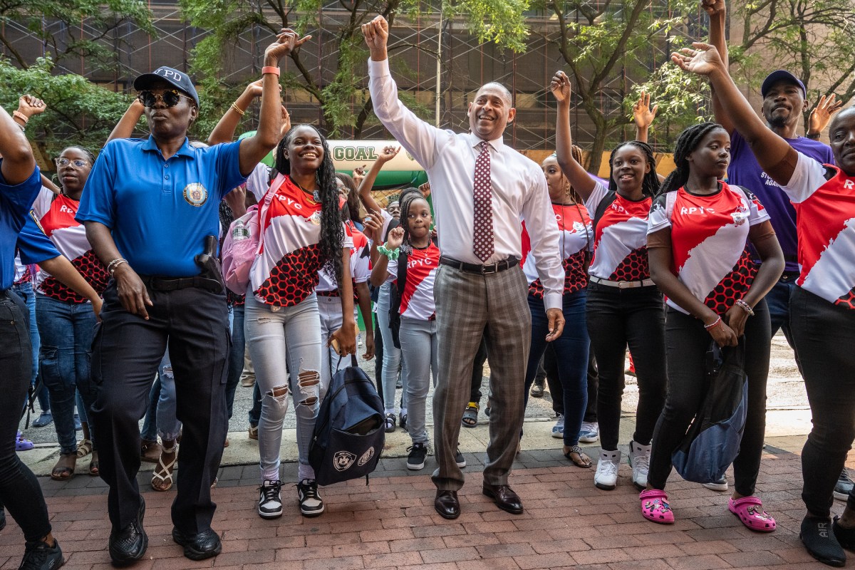 Det. Michelle Jones (left) and Deputy Commissioner Mark Stewart (middle) practiced their soca moves.