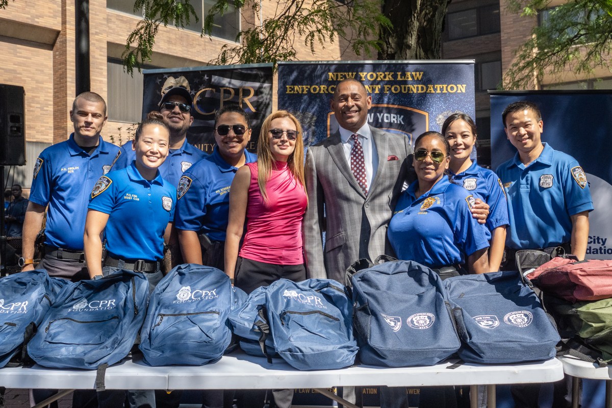 NYPD Deputy Commissioner Mark Stewart (middle) said it was important to prepare the kids for school.