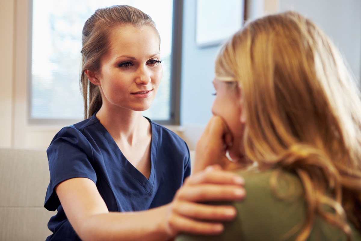 School nurse talking with teen