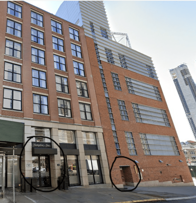 two buildings in Lower Manhattan with one being the site of a future low-barrier homeless shelter