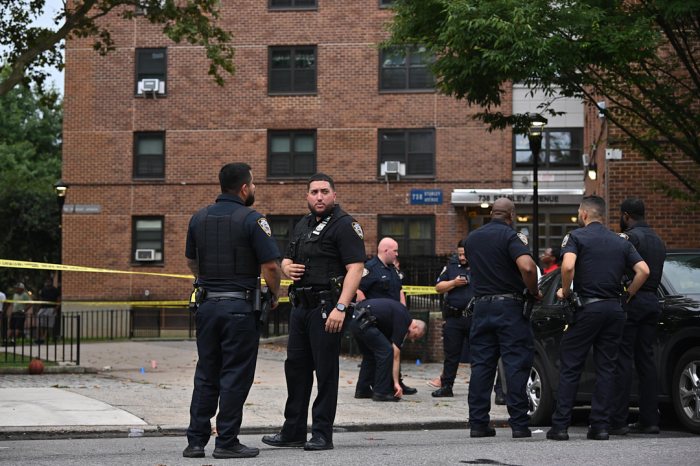 police in uniform outside a Brooklyn building