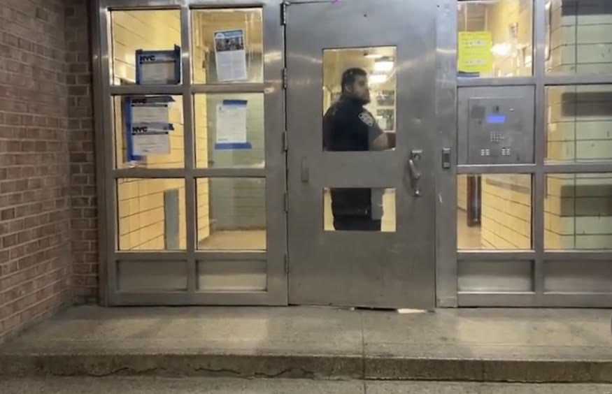 Police officer in the Bronx at the scene of a burglary