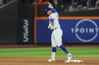 Mets' Francisco Lindor celebrates after hitting double