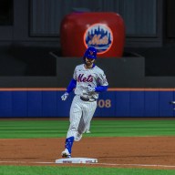 Mets DH Jesse Winker rounds third after hitting a grand slam