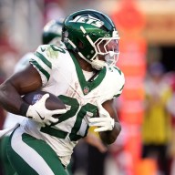 Jets RB Breece Hall carries the ball