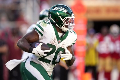 Jets RB Breece Hall carries the ball