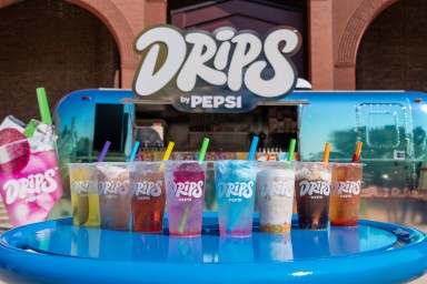 a line of DRIPS by Pepsi drinks on a table