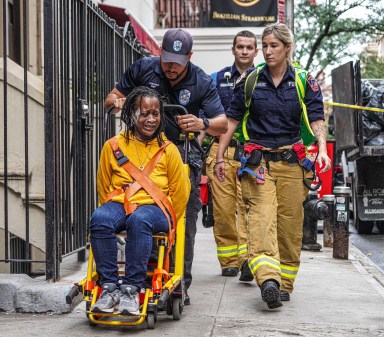 Distraught woman in tears after throwing objects off Midtown roof