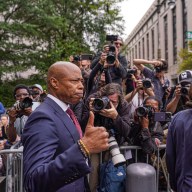 Mayor Eric Adams thumbs up after arraignment