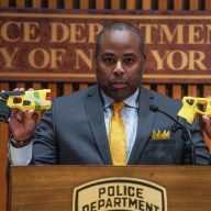 NYPD Assistant Commissioner Kaz Daughtry holding faulty Tasers