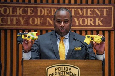 NYPD Assistant Commissioner Kaz Daughtry holding faulty Tasers