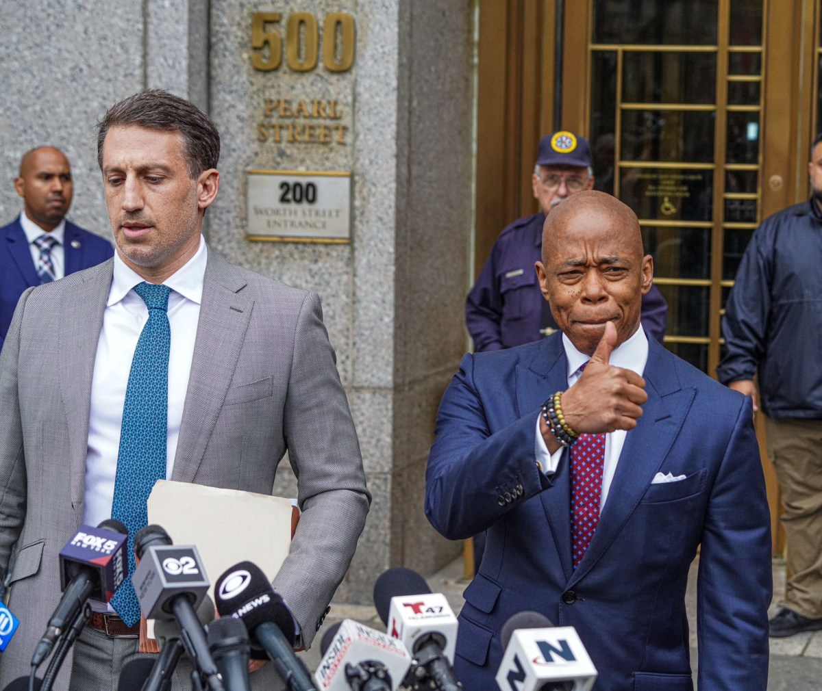 Mayor Adams with attorney gives a thumbs up after arraignment on indictment