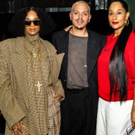 three people dressed up at New York Fashion Week.