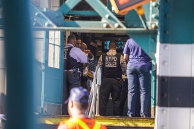 Police investigate a shooting at the Sutter Avenue station on the L line in Brooklyn on Sept. 15, 2024, that left four people, including a police officer, wounded.