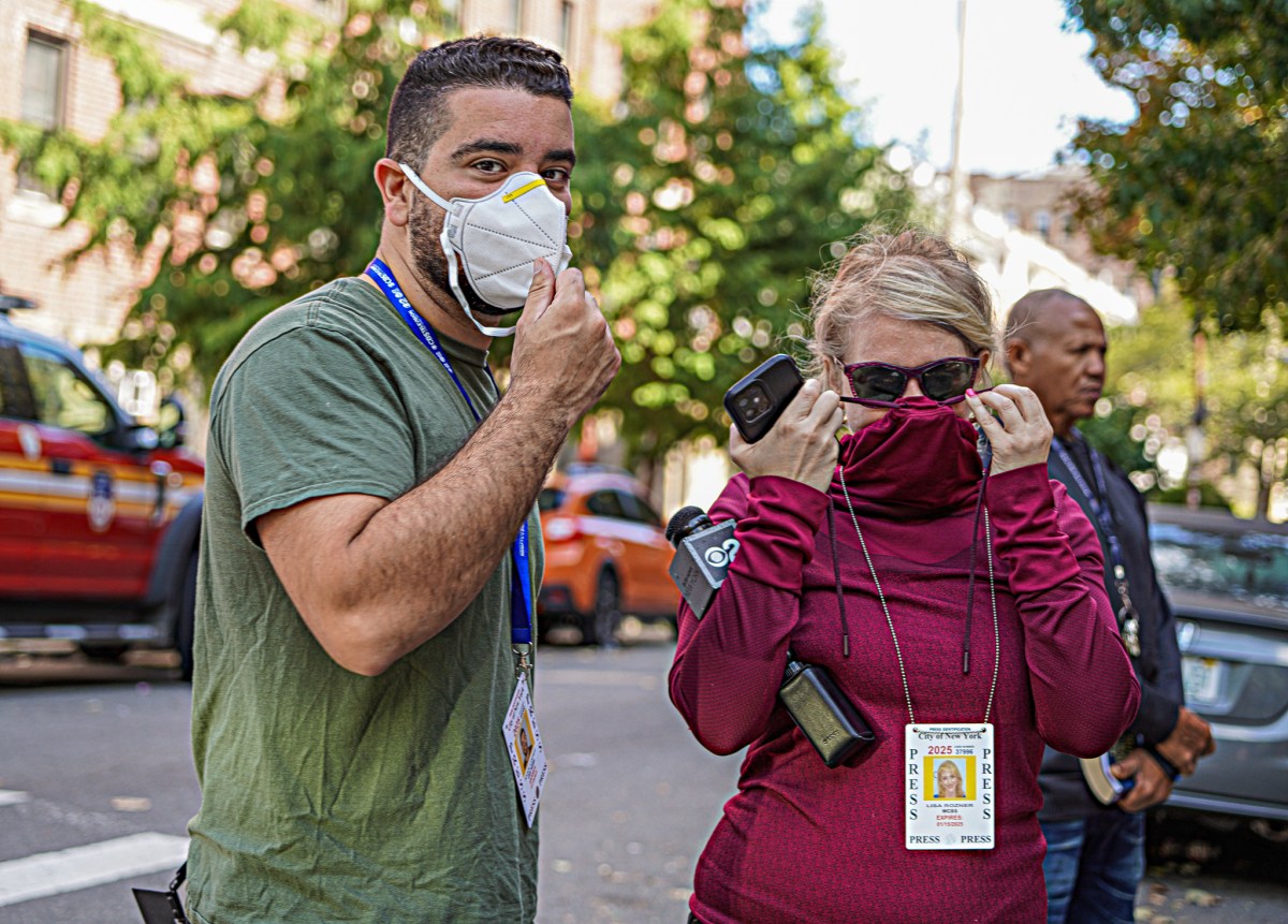 Even members of the press reporting on the incident scrambled to cover their faces.